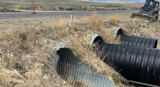 Inside view of corrugated metal pipe. 