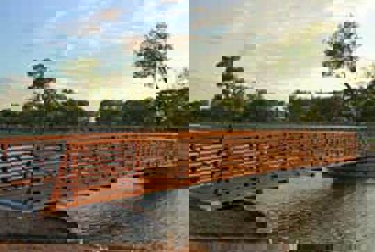 Continental pedestrian bridge over a river.