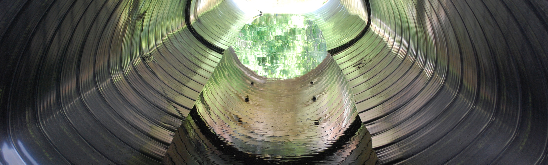 A culvert made from Smooth Cor corrugated metal pipe. 