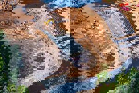 A dam spillway is being lined with Armorflex cellular concrete blocks.