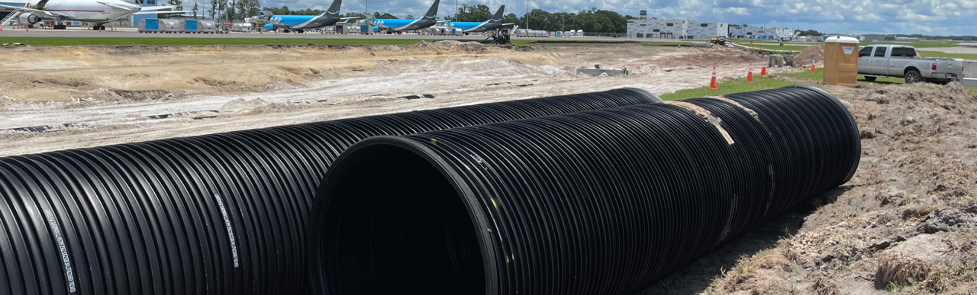 Installation of DuroMaxx steel-reinforced polyethylene (SRPE) pipe at an airport. 