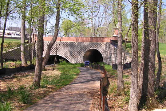 Structural plate being used for pedestrian and recreation traffic under a roadway.