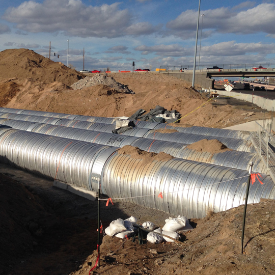 Installation of corrugated metal pipe. 