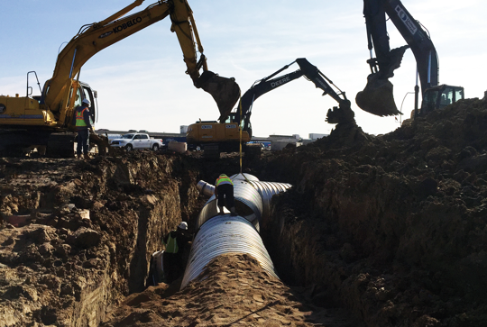 Installation of ULTRA FLO corrugated metal pipe.