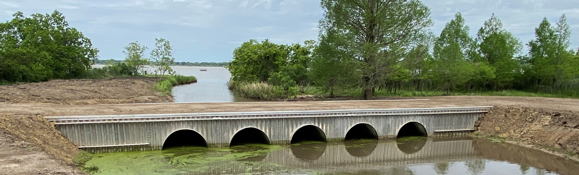 A culvert made from corrugated metal pipe.